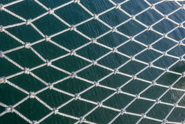 Safety net of a sailing ship above the sea abstract background. - Foto, immagini