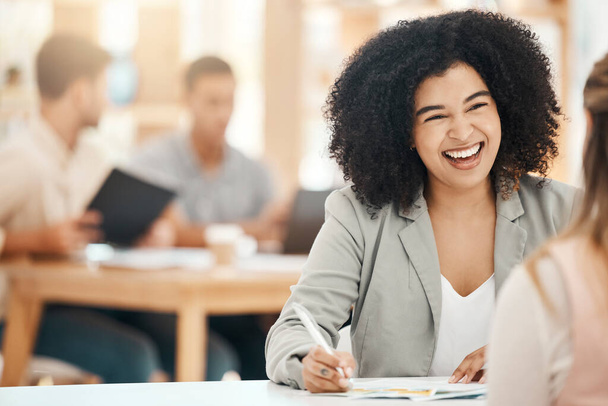 Happy black woman writing notes in office meeting, planning and strategy development with business motivation, happiness and mission for goals. Smile young business professional conversation at desk. - Photo, Image