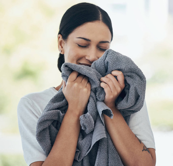 Clean laundry, happy woman and smelling towel, fresh scent and fabric, washing and linen textile at home. Young smile person, housekeeping service and domestic cleaning lifestyle. - Foto, Imagen