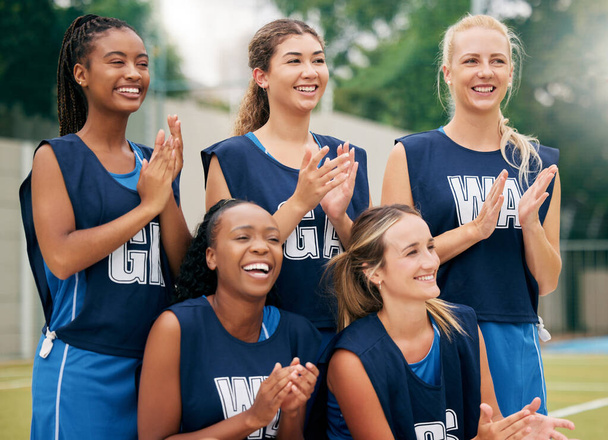 Netball, sports and women team applause, cheers and celebrate game, competition or training outdoor field support, motivation and teamwork. Happy athlete girl group clapping hands for winner goal. - Photo, Image