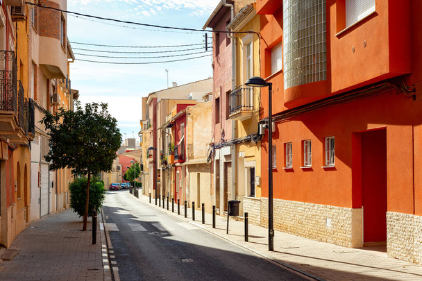 Street road with typical architecture of Mediterranean region in bright sunny day, Alicante, Spain - 写真・画像