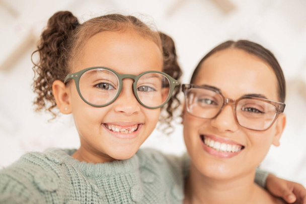 Woman with glasses, eye care for child and frame lens with happy girl face or optician vision for sight. Family portrait with mother, advertising optometrist spectacles deal and eyes looking together. - Photo, image