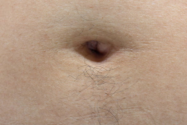 Navel of a teenage girl, front view close-up - Foto, Imagem