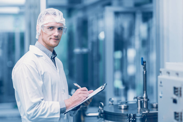 portrait medicine factory scientist worker work in Laboratory Plants Process. medical doctor working research in pharmaceutical industry looking smile. - Photo, Image