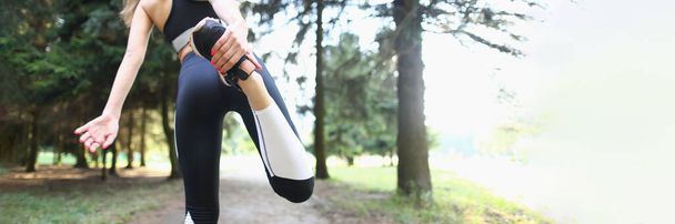 Low angle of fit woman standing back and stretching legs for productive morning run. Sportswoman do every day ritual. Active lifestyle, fitness concept - Fotoğraf, Görsel