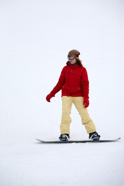 Girl on a snowboard - Foto, Bild