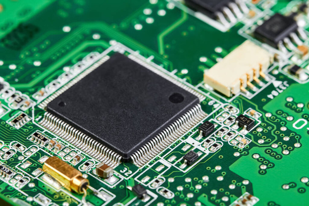 Close-up of computer chip on a part of electronic printed circuit board - Photo, Image