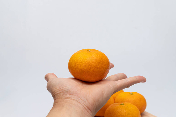 Sweet and delicious looking tangerines concept on white background - Foto, Imagem