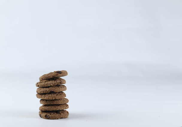 Lots of cookies on white background with copy space for your ad. Butter Chocolate chip cookies isolated on white background. Sweet biscuits. Homemade pastry. - Foto, Bild