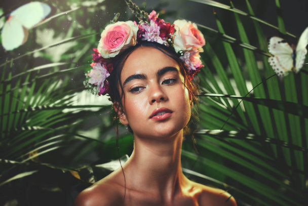 Beauty, nature and crown flower on woman in nature jungle for skincare, health and wellness with tropical dermatology product, cosmetics or makeup. Aesthetic spring model with natural floral mockup. - Foto, afbeelding
