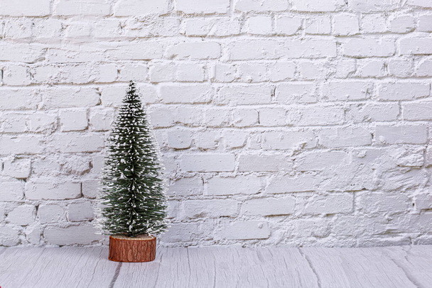 Christmas tree, December 31 calendar, gifts, snowman on the background of a brick wall close-up - Фото, изображение