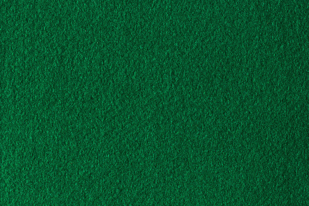 Green color felt textile fabric material texture background. Abstract monochrome dark blue color felt background. - Фото, изображение
