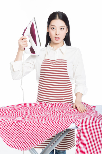 young housewife ironing - 写真・画像