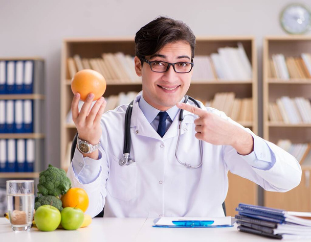 The doctor in dieting concept with fruits and vegetables - Photo, Image