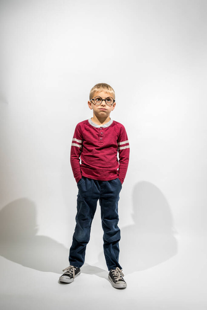 Little Boy Wearing Big Glasses Looking Bored Against a White Background - Photo, Image