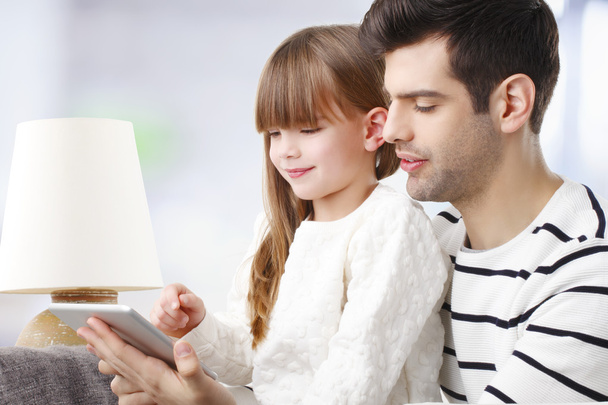 Girl and father with tablet - Photo, image