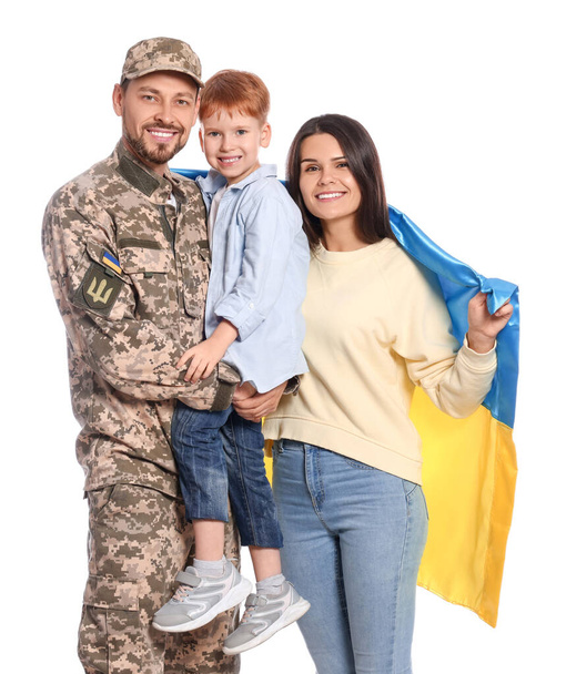 Ukrainian defender in military uniform and his family with flag on white background - Φωτογραφία, εικόνα