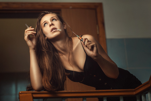 Girl addict with syringe. - Φωτογραφία, εικόνα