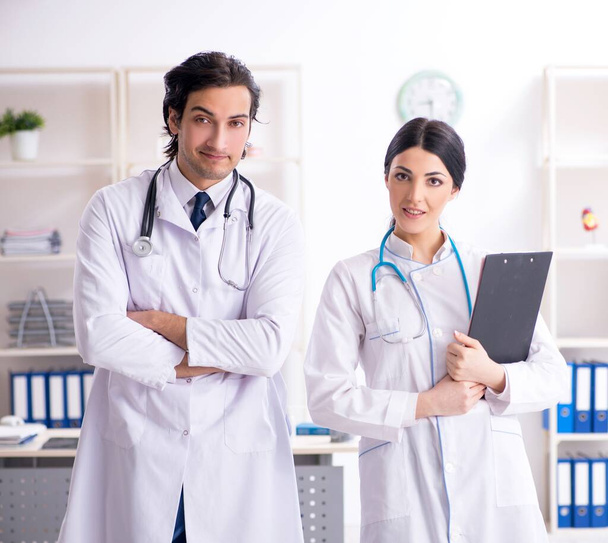 The two young doctors working in the clinic - Photo, Image