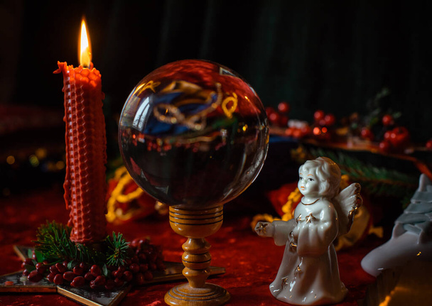 Concept of Christmas atmosphere, divination, fate predictions, magical ball and other magic. Illustration of magical Holidays aesthetic - Photo, Image