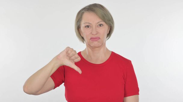 Thumbs Down by Senior Old Woman on White Background - Photo, Image