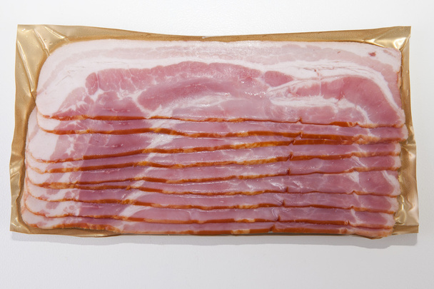 Fatias de bacon no pacote
 - Foto, Imagem
