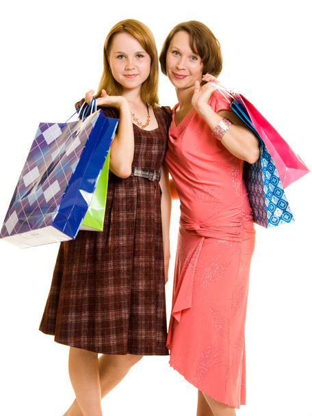 Girls with shopping on white background. - Photo, Image