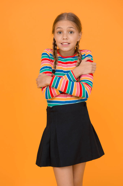 Just freezing here. Fashion shop. Must have accessory. Modern fashion. Kid fashion. Cute child trendy and fancy. Little girl wearing rainbow clothes. Emotional kid. Cold weather. Need warm clothes. - Zdjęcie, obraz