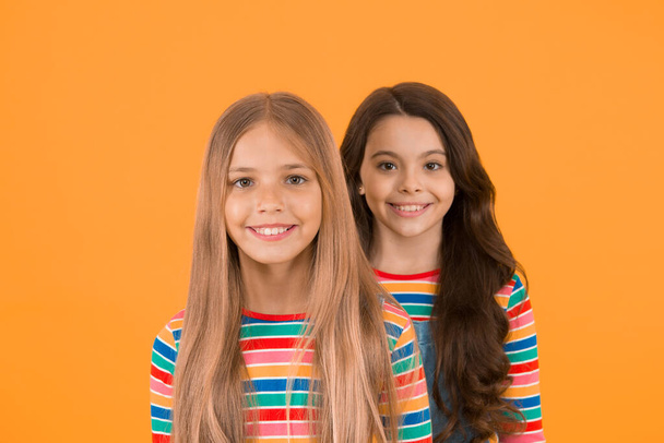 For any hair type. Blonde and brunette. Healthy and shiny hair. Kids cute children with long hairstyle. Hairdo tips. Long hair feminine attribute. Girls let their hair grow long. Natural beauty. - Zdjęcie, obraz