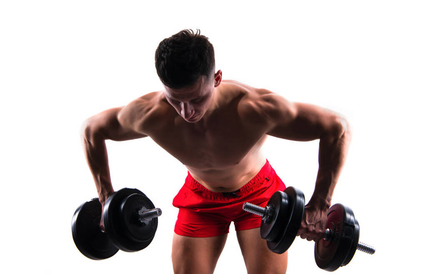 gym training of biceps and triceps in weightlifting sport. sportsman with gym dumbbell do weightlifting sport. weightlifting sport in gym. sportsman do weightlifting in sport gym isolated on white. - Foto, afbeelding
