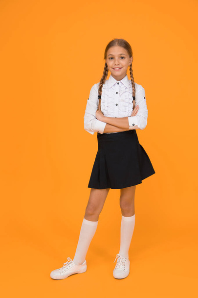 confident in knowledge. learning well bring future success. knowledge day. childhood development. girl in uniform. pretty little girl ready to study. back to school. education online while quarantine. - Photo, Image
