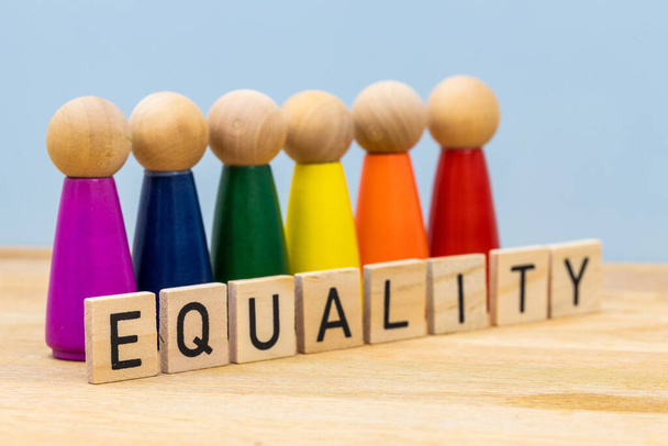 Symbol of equality, Wooden figures of people in symbolic lgbt colors, wooden signs arranged in the word Equality - Photo, Image