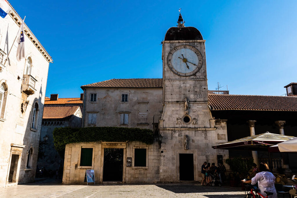 TROGIR, CROATIA - OCTOBER 31, 2022: The Clock Tower and City Loggia. The clock tower was part of the Church of St. Sebastian. - Zdjęcie, obraz