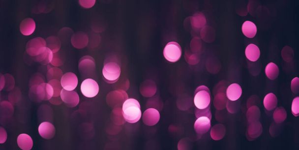 Dark party background with bokeh lights in purple color. - Foto, afbeelding