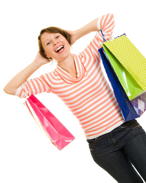 Girl with shopping on white background. - Фото, изображение