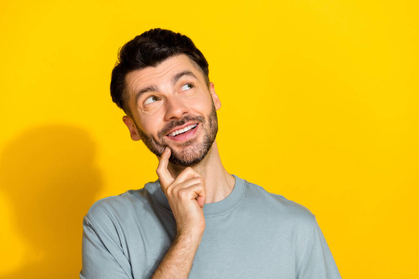 Closeup photo of young funny positive cute dreamy bearded man touch finger cheeks information empty space sale isolated on bright yellow color background. - Fotoğraf, Görsel