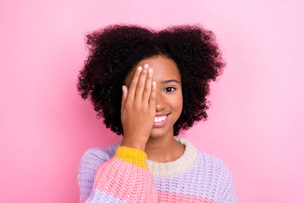 Closeup portrait of childish beautiful lady cover eye toothy smile funky chevelure positive mood check vision isolated on pink color background. - Photo, Image