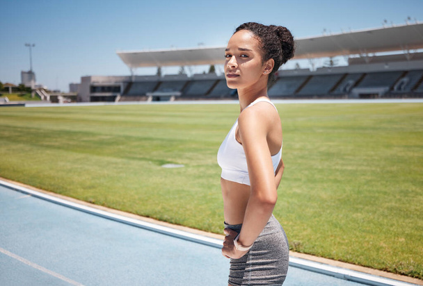 Sports, runner and portrait of woman in stadium ready for training, exercise or workout. Fitness, health or black female athlete on outdoors race track preparing for running, marathon or olympic race. - Foto, Imagem