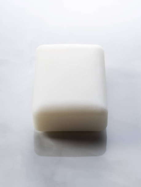 White solid soap placed on marble background. - Photo, Image
