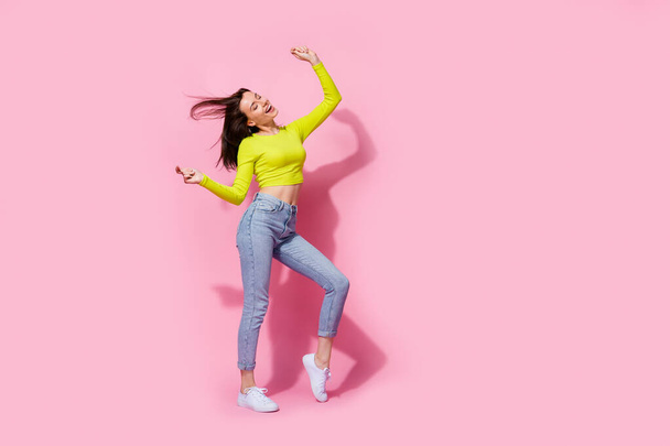 Full length photo of pretty cheerful crazy positive trendy girl enjoy clubbing empty space isolated on pink color background. - Foto, afbeelding
