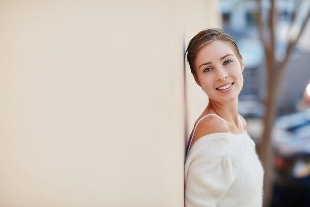 Dont let anyone dull your sparkle. Portrait of a smiling young woman standing outside - Foto, Imagen