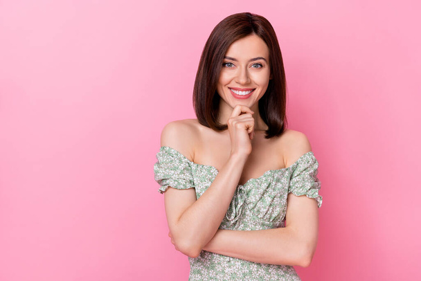 Photo of thoughtful pretty girl dressed off shoulders outfit arm chin empty space isolated pink color background. - Zdjęcie, obraz
