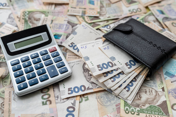 Ukrainian hryvnias bills with purse calculator. Money of Ukraine. UAH hrn. payment - Valokuva, kuva