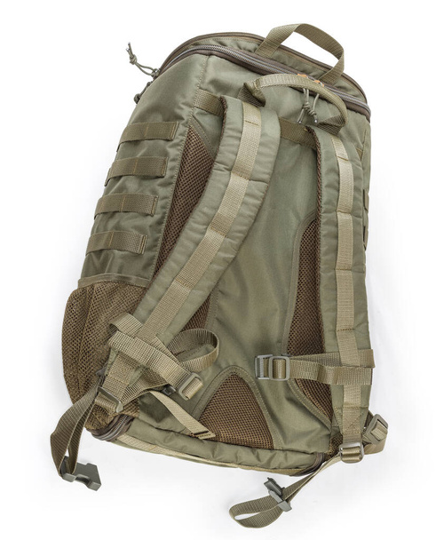 Textile military tactical backpack of green-brown protective color, view from shoulder straps side on a white background - Photo, Image