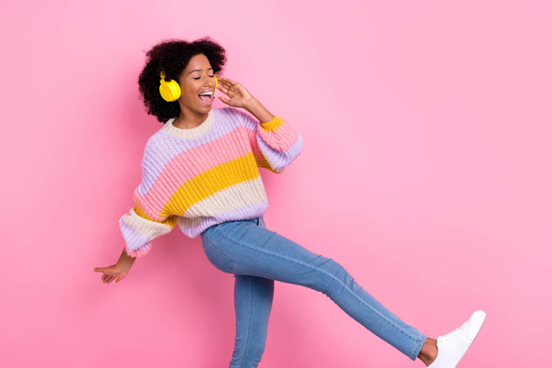 Photo of positive funny good mood girl with perming coiffure dressed knit sweater headphones dancing isolated on pink color background. - Foto, afbeelding