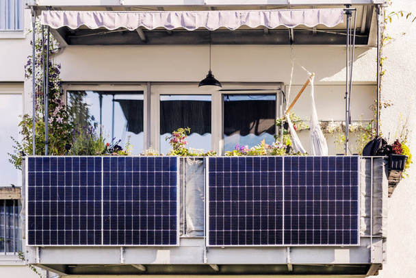 Solar Panel on Balcony of Modern Apartment Building. Modern Balcony with Solar Panels, Marquise and Garden - Photo, Image