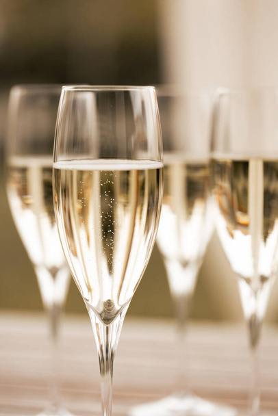 Festive photo of sparkling wine in glasses - Valokuva, kuva
