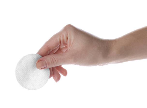 Woman holding soft clean cotton pad on white background, closeup - Foto, Bild
