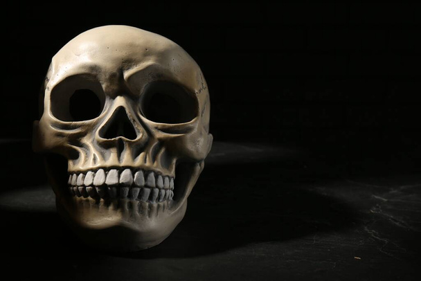 Old human skull with teeth on black background. Space for text - Foto, Imagem