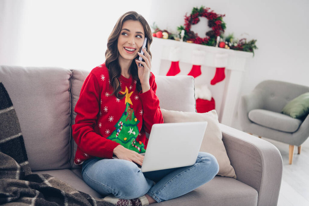 Photo of positive cheerful lady freelancer sit sofa cozy room indoors distance work speaking gadget colleagues friends look window. - Foto, immagini